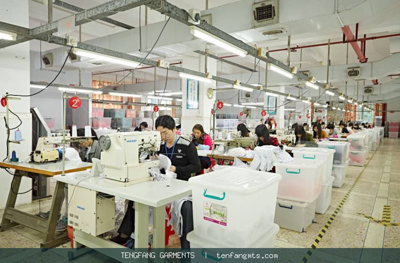 Garment production team at work in a bright sewing workshop